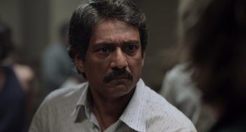 Movie still from “Life of Pi” (2012), directed by Ang Lee – A person wearing a shirt; Close Up shot, Over the shoulder angle