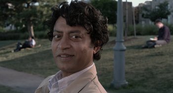 Movie still from “Life of Pi” (2012), directed by Ang Lee – A person with curly hair; Close Up shot, Over the shoulder angle