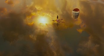 Movie still from “Life of Pi” (2012), directed by Ang Lee – A person rowing a boat on a body of water at sunset; Extreme Wide shot, High angle