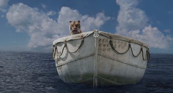 Movie still from “Life of Pi” (2012), directed by Ang Lee – A tiger sitting on top of a boat in the water; Wide shot, Low angle