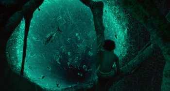 Movie still from “Life of Pi” (2012), directed by Ang Lee – A man sitting under a tree in the water; Extreme Wide shot, Overhead angle