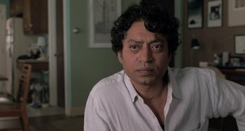 Movie still from “Life of Pi” (2012), directed by Ang Lee – A person wearing a white shirt; Close Up shot, Over the shoulder angle