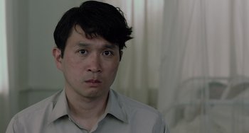 Movie still from “Life of Pi” (2012), directed by Ang Lee – A person wearing a white shirt; Close Up shot, Over the shoulder angle