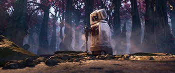 Movie still from “Lightyear” (2022), directed by Angus MacLane – An animated robot is standing next to a tree; Wide shot, Low angle