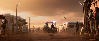 Movie still from “Lightyear” (2022), directed by Angus MacLane – A group of people standing around a car in the dirt; Extreme Wide shot, Low angle