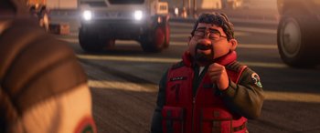 Movie still from “Lightyear” (2022), directed by Angus MacLane – A man in a red vest is standing in the street; Medium shot, Over the shoulder angle