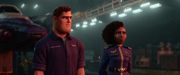 Movie still from “Lightyear” (2022), directed by Angus MacLane – A man and a woman standing next to each other; Medium shot, Over the shoulder angle