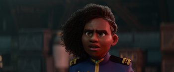 Movie still from “Lightyear” (2022), directed by Angus MacLane – A person with curly black hair and a blue uniform; Close Up shot, Over the shoulder angle