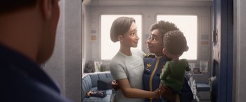 Movie still from “Lightyear” (2022), directed by Angus MacLane – A woman and two children are hugging in a room; Medium shot, Over the shoulder angle