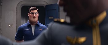Movie still from “Lightyear” (2022), directed by Angus MacLane – A man in a uniform is looking at another man in a uniform; Medium shot, Over the shoulder angle