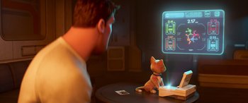 Movie still from “Lightyear” (2022), directed by Angus MacLane – A man sitting in front of a cat on a computer screen; Medium shot, Over the shoulder angle