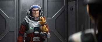 Movie still from “Lightyear” (2022), directed by Angus MacLane – A man holding a cat in his hand; Medium shot, Over the shoulder angle