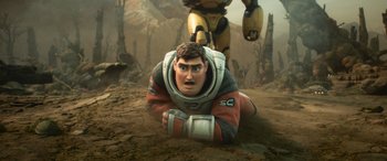 Movie still from “Lightyear” (2022), directed by Angus MacLane – An image of a man laying on the ground next to a robot; Medium shot, Low angle