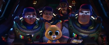 Movie still from “Lightyear” (2022), directed by Angus MacLane – A group of people in a room next to a cartoon cat; Medium shot, Over the shoulder angle