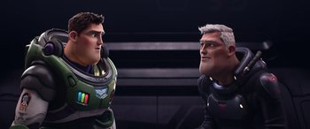 Movie still from “Lightyear” (2022), directed by Angus MacLane – Two people are standing next to each other in a room; Close Up shot, Over the shoulder angle