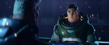Movie still from “Lightyear” (2022), directed by Angus MacLane – A man sitting in front of another man in front of a window; Medium shot, Over the shoulder angle