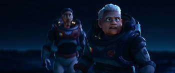 Movie still from “Lightyear” (2022), directed by Angus MacLane – A couple of people that are standing in the dark; Medium shot, Low angle