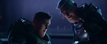 Movie still from “Lightyear” (2022), directed by Angus MacLane – A man and a boy are looking at each other; Medium shot, Over the shoulder angle