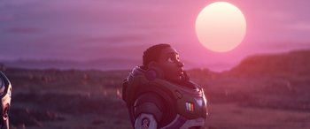 Movie still from “Lightyear” (2022), directed by Angus MacLane – An animated character looking up at the sun; Medium shot, Over the shoulder angle