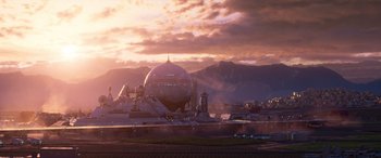 Movie still from “Lightyear” (2022), directed by Angus MacLane – An airplane is flying in front of a mountain range; Extreme Wide shot, Low angle
