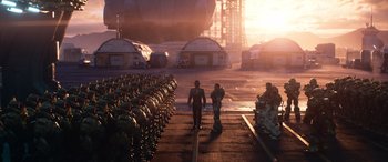 Movie still from “Lightyear” (2022), directed by Angus MacLane – A group of men standing next to each other on a runway; Extreme Wide shot, High angle