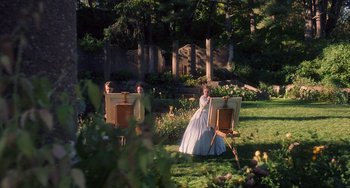 Movie still from “Little Women” (2019), directed by Greta Gerwig – Two young girls painting in a garden setting; Extreme Wide shot, High angle
