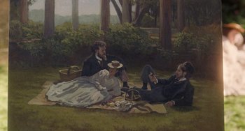 Movie still from “Little Women” (2019), directed by Greta Gerwig – A painting of three people sitting on a blanket in the grass; Wide shot, High angle