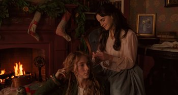 Movie still from “Little Women” (2019), directed by Greta Gerwig – Two young women are combing each other's hair; Medium shot, Over the shoulder angle