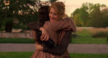 Movie still from “Little Women” (2019), directed by Greta Gerwig – Two women hugging each other in a field; Medium shot, Over the shoulder angle