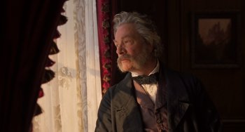 Movie still from “Little Women” (2019), directed by Greta Gerwig – An old man with a beard and a bow tie; Close Up shot, Low angle
