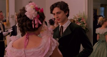 Movie still from “Little Women” (2019), directed by Greta Gerwig – A man and a woman dressed in formal clothing; Close Up shot, Over the shoulder angle