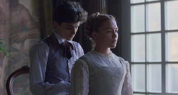 Movie still from “Little Women” (2019), directed by Greta Gerwig – A young man and a young woman standing next to each other; Medium shot, Low angle