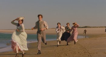 Movie still from “Little Women” (2019), directed by Greta Gerwig – A group of people running on the beach; Wide shot, High angle