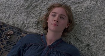 Movie still from “Little Women” (2019), directed by Greta Gerwig – A woman laying on the ground with her eyes closed; Close Up shot, Overhead angle