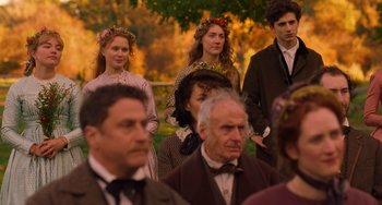 Movie still from “Little Women” (2019), directed by Greta Gerwig – A group of people standing in front of a tree; Medium shot, Over the shoulder angle