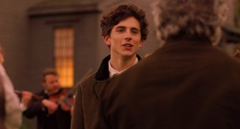 Movie still from “Little Women” (2019), directed by Greta Gerwig – A young man is talking to an older man; Close Up shot, Over the shoulder angle