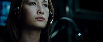 Movie still from “Live Free or Die Hard” (2007), directed by Len Wiseman – A person wearing headphones in a car; Close Up shot, Low angle