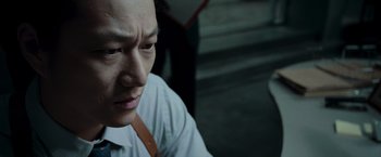 Movie still from “Live Free or Die Hard” (2007), directed by Len Wiseman – A person wearing a white shirt; Close Up shot, High angle