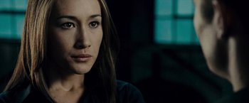 Movie still from “Live Free or Die Hard” (2007), directed by Len Wiseman – A person with long hair; Close Up shot, Over the shoulder angle