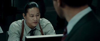 Movie still from “Live Free or Die Hard” (2007), directed by Len Wiseman – A man sitting in front of a mirror looking at himself in the mirror; Close Up shot, Over the shoulder angle