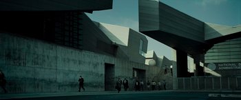 Movie still from “Live Free or Die Hard” (2007), directed by Len Wiseman – A group of people walking down a street; Extreme Wide shot, Low angle