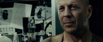 Movie still from “Live Free or Die Hard” (2007), directed by Len Wiseman – A man's face in front of a camera; Close Up shot, Over the shoulder angle