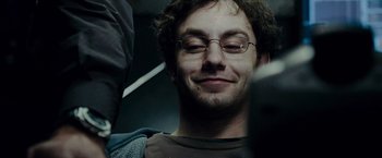 Movie still from “Live Free or Die Hard” (2007), directed by Len Wiseman – A person wearing glasses; Close Up shot, Low angle