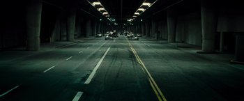Movie still from “Live Free or Die Hard” (2007), directed by Len Wiseman – Cars are driving down the street in an empty tunnel; Extreme Wide shot, High angle
