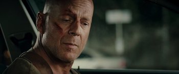 Movie still from “Live Free or Die Hard” (2007), directed by Len Wiseman – A man's face in a car; Close Up shot, Over the shoulder angle