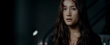 Movie still from “Live Free or Die Hard” (2007), directed by Len Wiseman – A young woman with blood all over her face; Close Up shot, Low angle