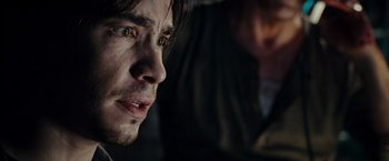 Movie still from “Live Free or Die Hard” (2007), directed by Len Wiseman – A man's face in a dark room; Close Up shot, Over the shoulder angle