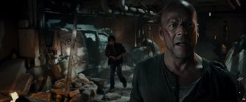Movie still from “Live Free or Die Hard” (2007), directed by Len Wiseman – A man and a woman in a destroyed building; Medium shot, Over the shoulder angle
