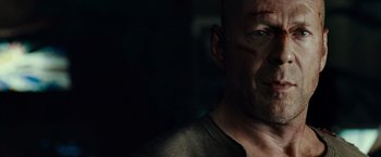 Movie still from “Live Free or Die Hard” (2007), directed by Len Wiseman – A man's face in the dark; Close Up shot, Low angle