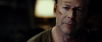 Movie still from “Live Free or Die Hard” (2007), directed by Len Wiseman – A person with a face paint; Close Up shot, Over the shoulder angle
